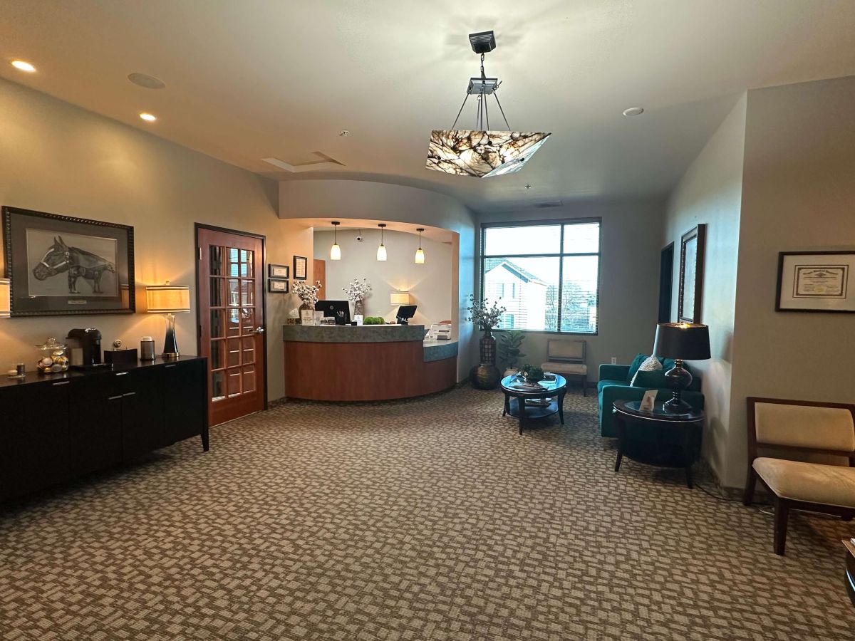 Lobby of Hayden Dental office in Hermiston, Oregon featuring reception desk, seating area, and modern welcoming design.